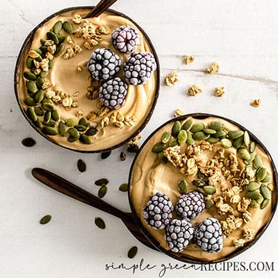 Close up of the Easy Peanut Butter and Banana Smoothie Bowls on a photography backdrop.