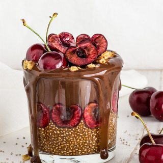 Chocolate chia pudding with vegan ice cream and cherries