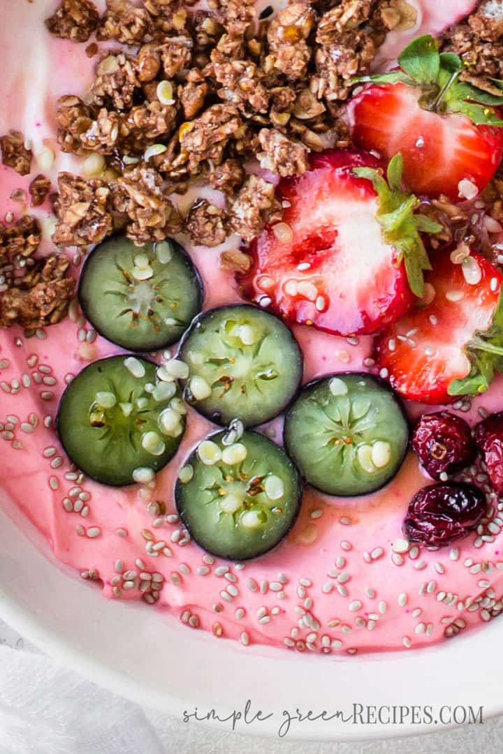 Over head shot of the Strawberry Banana Smoothie Bowl topped with delicious toppings.