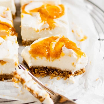 Close up of a bitten bar of the No Bake Vegan Peach Cheesecake