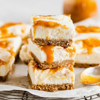 Close up of the Raw Vegan Cheesecake bars stacked and topped with peach jam.