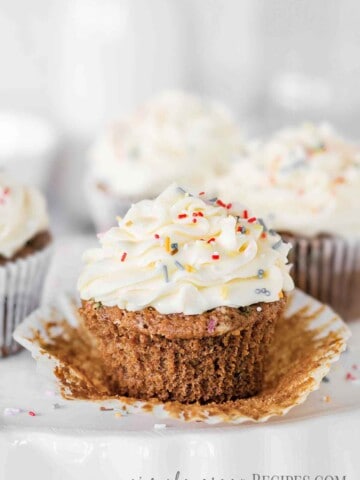 Cupcakes frosted with vanilla buttercream and topped with colourful sprinkles