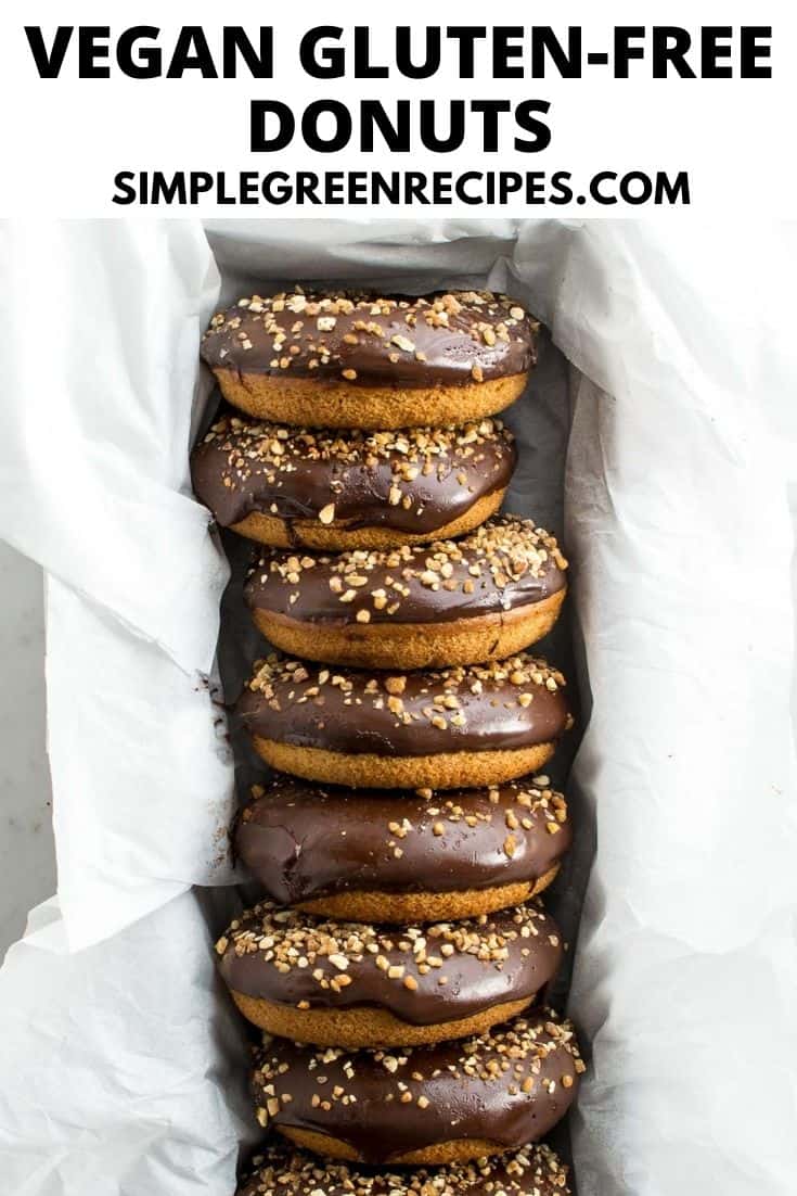 8 donuts frosted with glaze chocolate and crunchy almonds, placed in a loaf pan lined with parchment paper