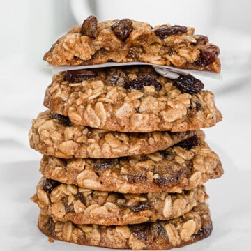 Stack of oatmeal raisin cookies on a parchment paper