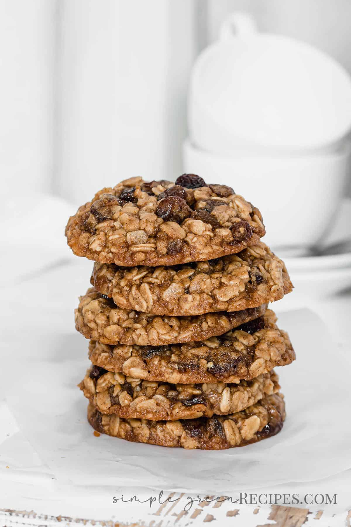 Stack of oatmeal raisin cookies on a parchment paper