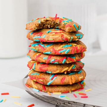 Stack of cookies with sprinkles on a cooling rack