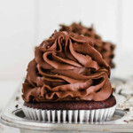 chocolate cupcake frosted with chocolate frosting, placed in a muffin pan
