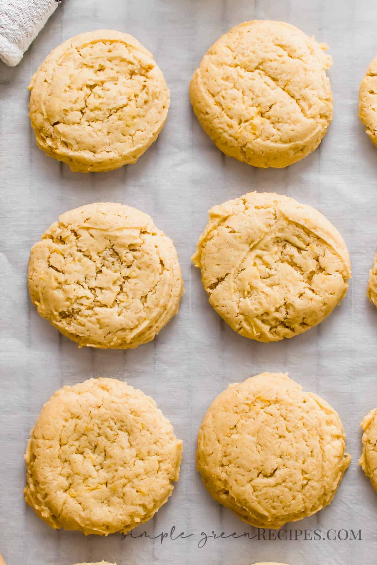 Cookies on a parchment paper over a cooling rack.