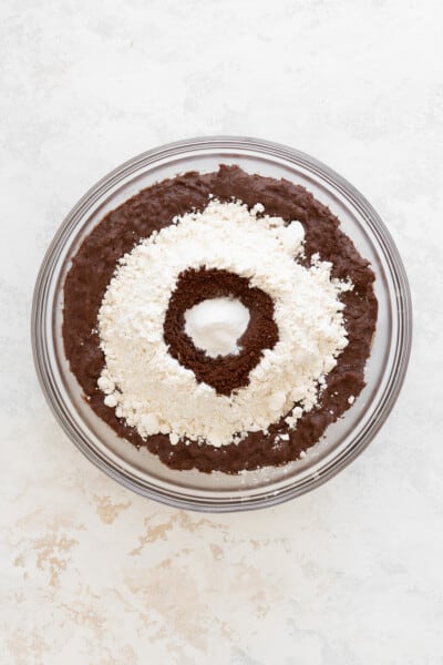 glass bowl with brownie batter, flour, instant coffee and baking powder.