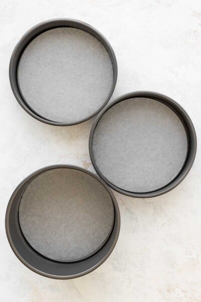 three lined grey cake pans