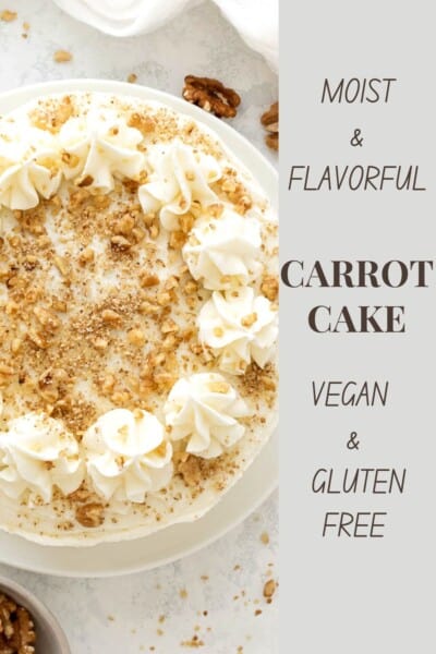 carrot cake frosted with cream cheese frosting and topped with crushed nuts
